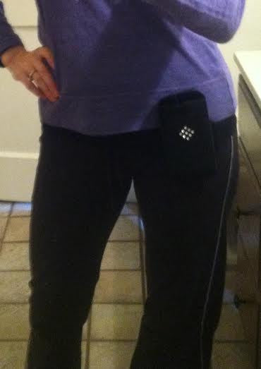 a person wearing a purple shirt and black pants