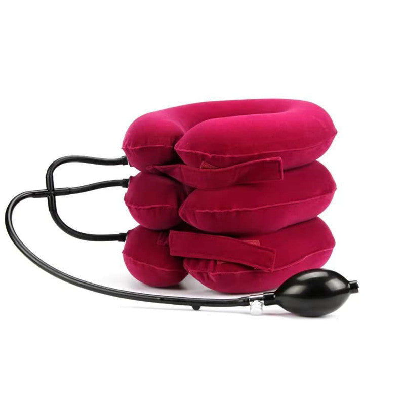 a red pillow with a black tube