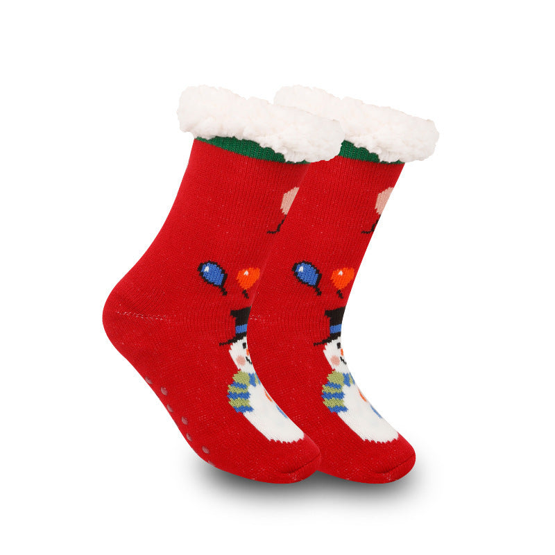 a pair of red socks with snowman designs