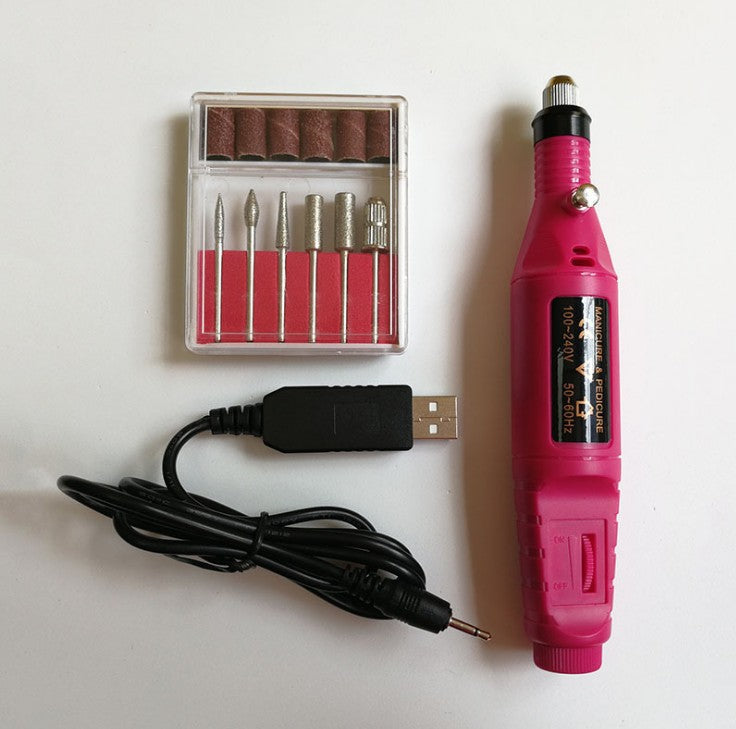 a pink electric nail drill and a box of bits