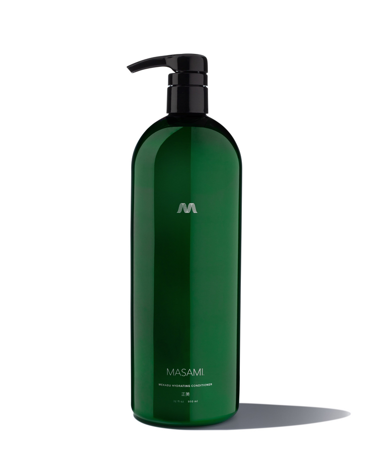 a green bottle with a black pump