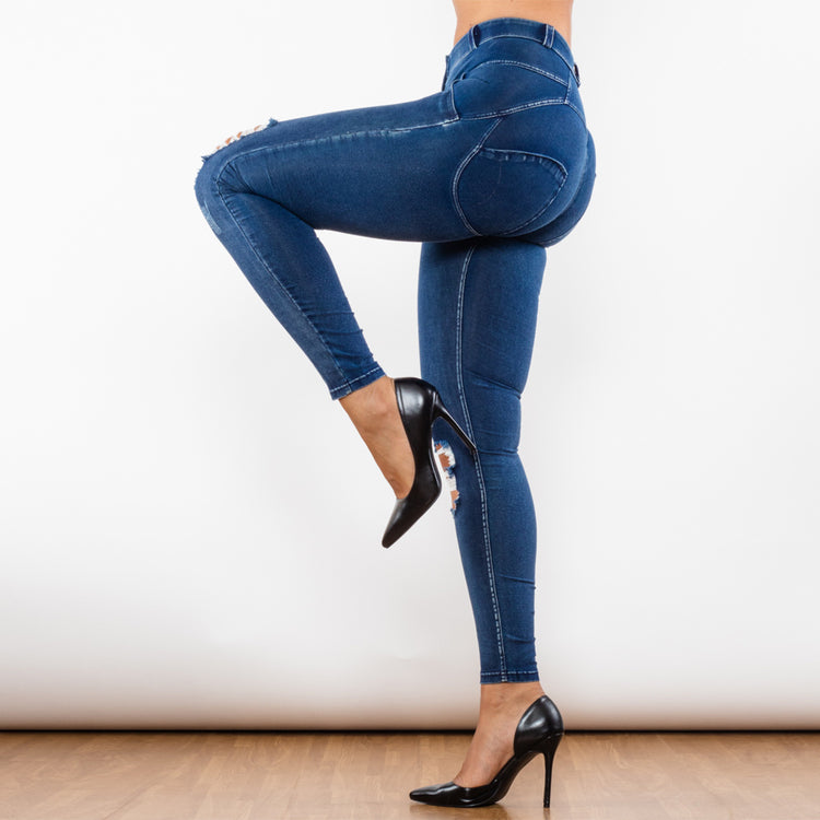 a woman wearing jeans and high heels