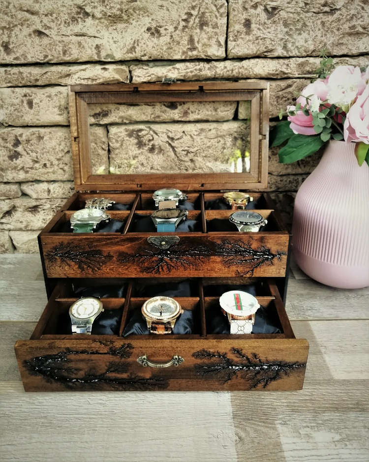 a wooden box with watches in it