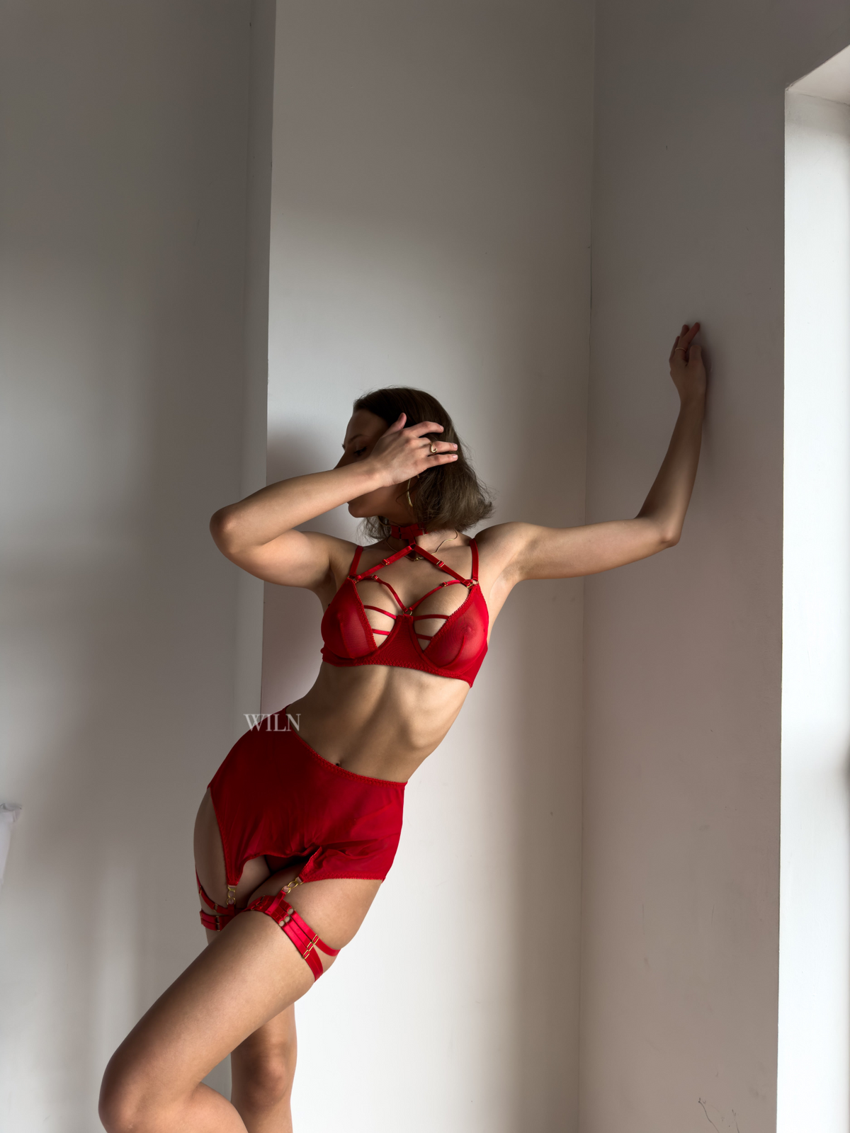 a woman in red underwear and garment