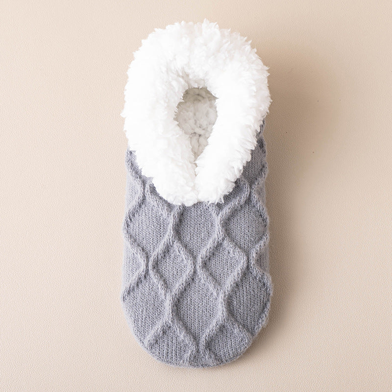 a knitted sock with a white fur inside