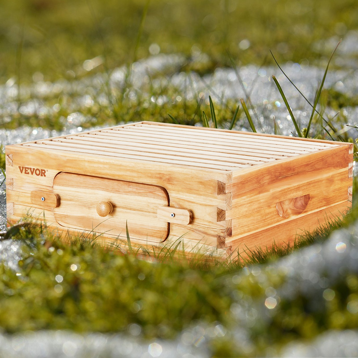 a wooden box in the grass