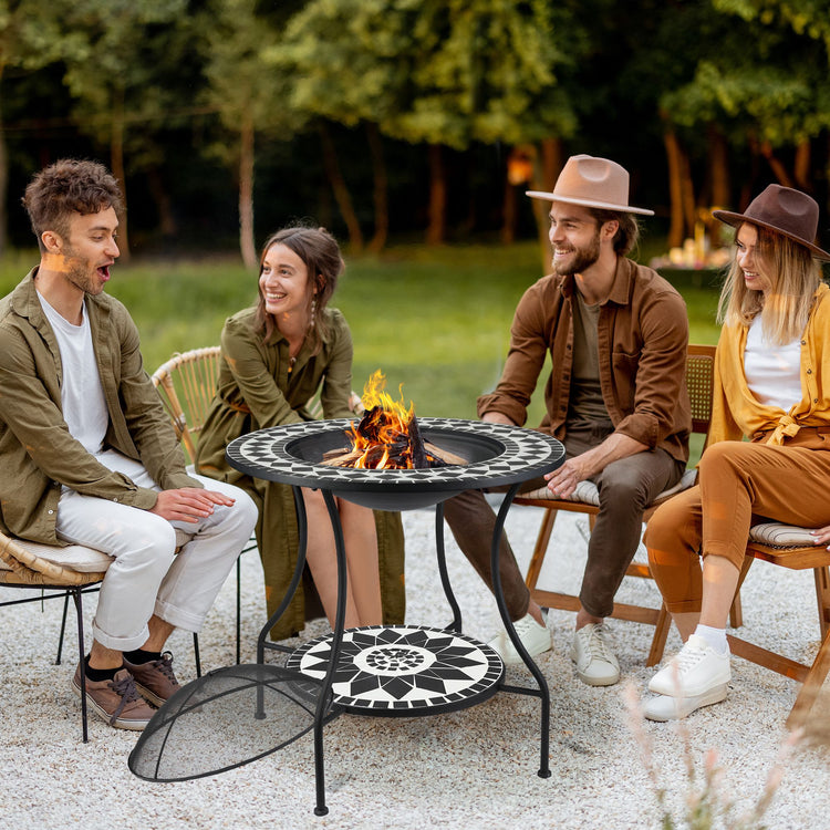 a group of people sitting around a fire pit