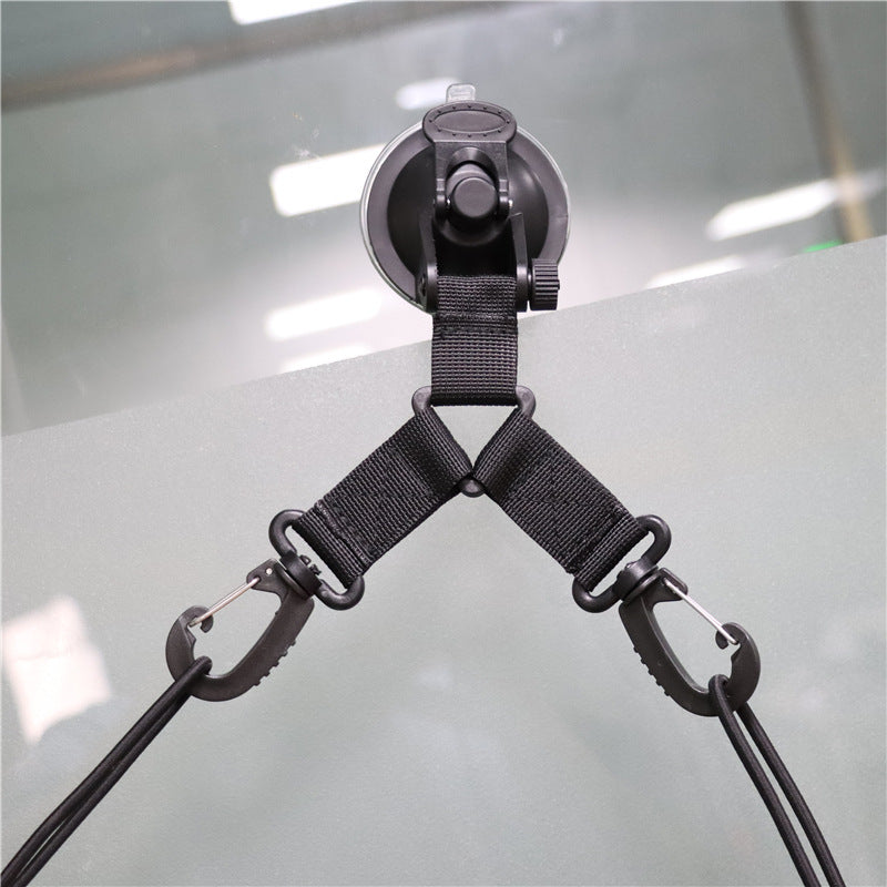 a suction cup with a black strap attached to it