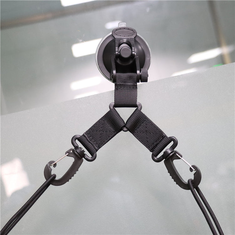 a suction cup with a black strap attached to it