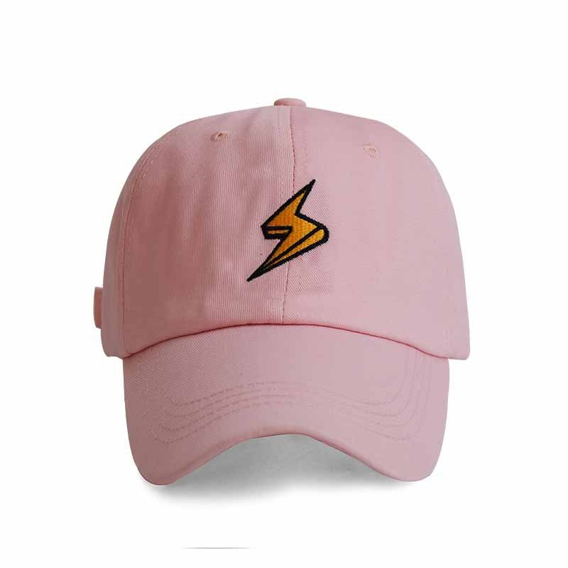 a pink hat with a lightning bolt on it