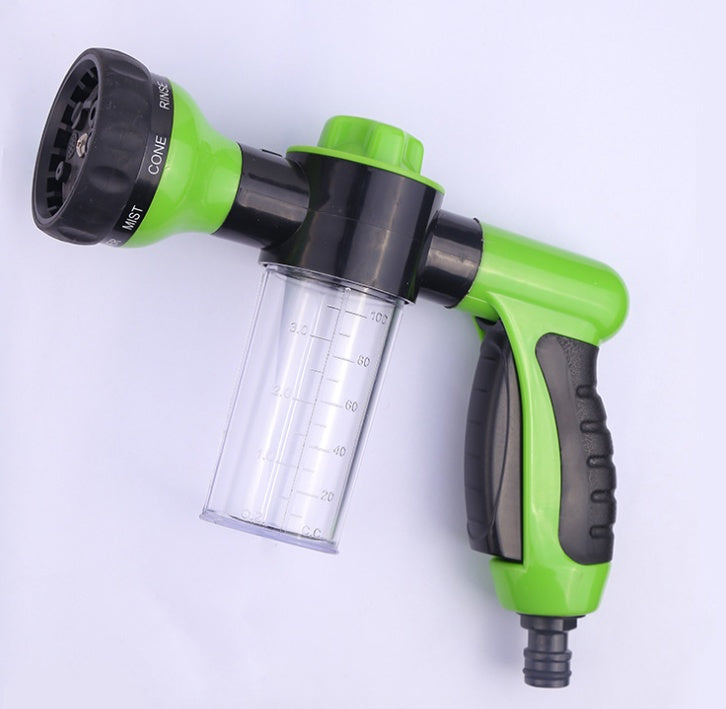 a green and black garden hose nozzle