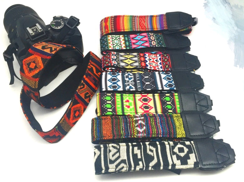 a camera strap with colorful straps