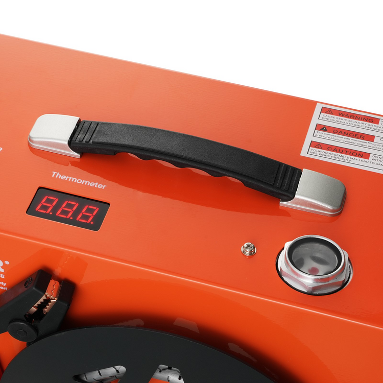 an orange thermometer with a black handle