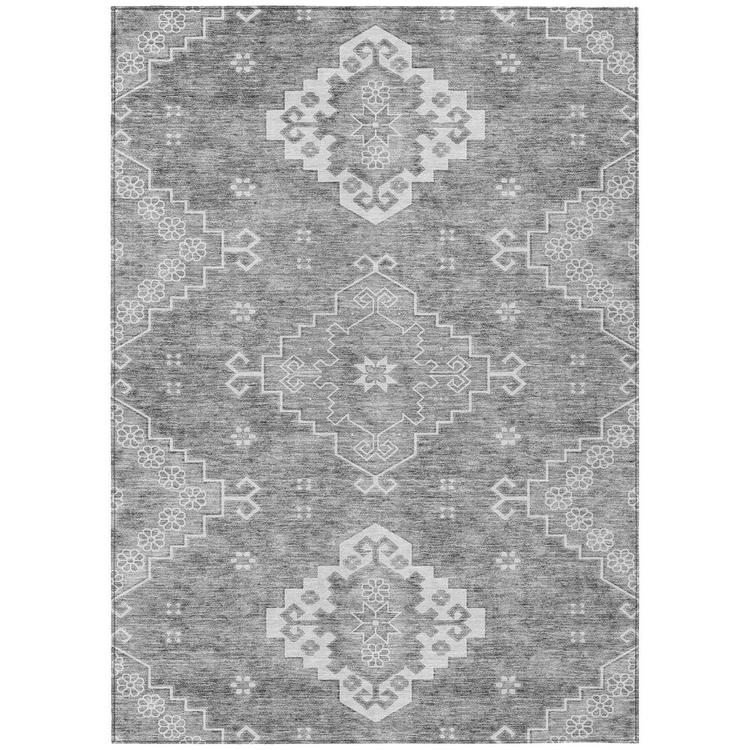 a grey and white rug with a pattern