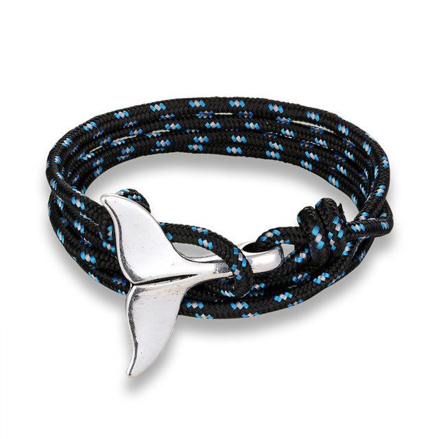 a bracelet with a silver whale tail