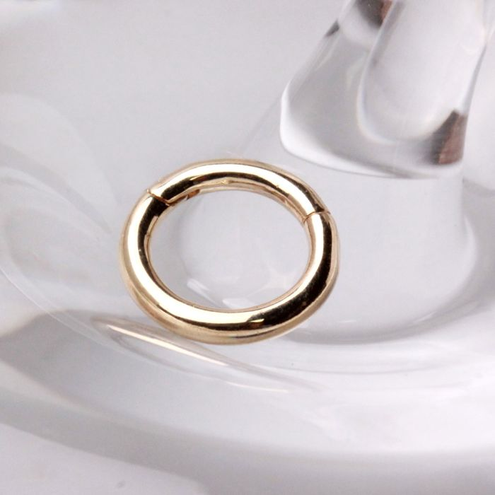 a gold ring on a glass