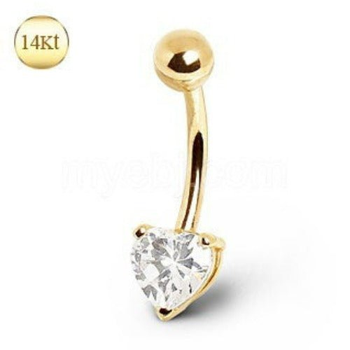 a gold belly button with a heart shaped diamond
