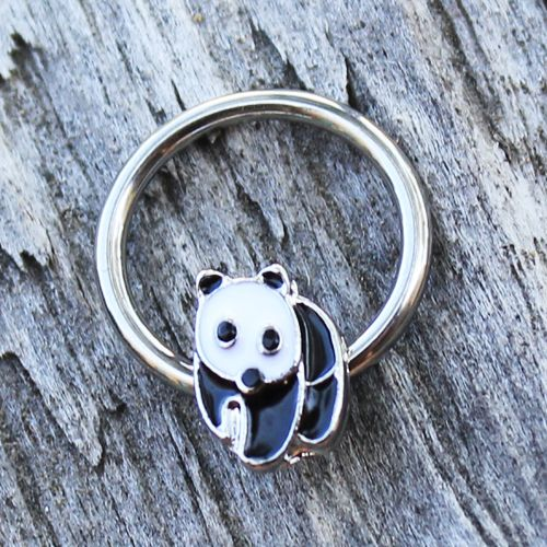 a silver ring with a panda face on it