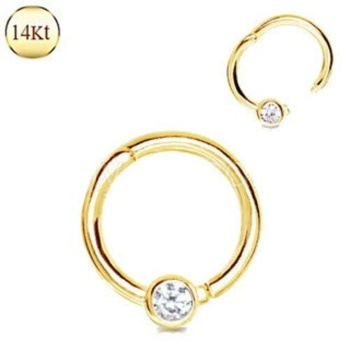 a gold ring with a diamond