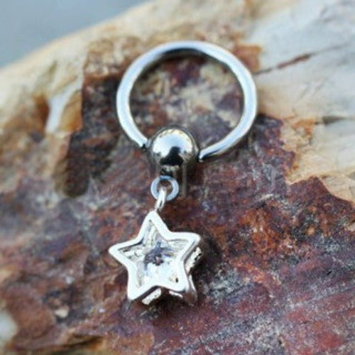 a silver ring with a star charm