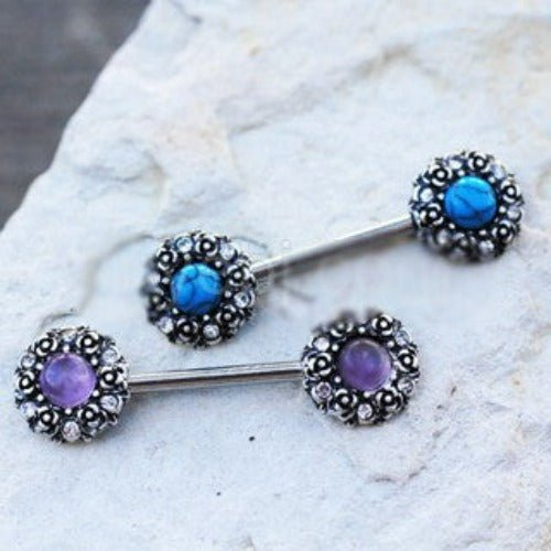 a pair of earrings with gemstones