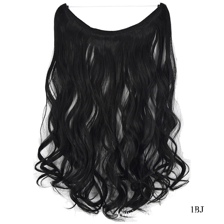 a black hair piece on a white background