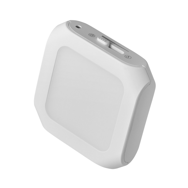 a white square object with buttons and a light
