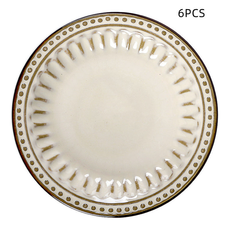 a white plate with gold trim