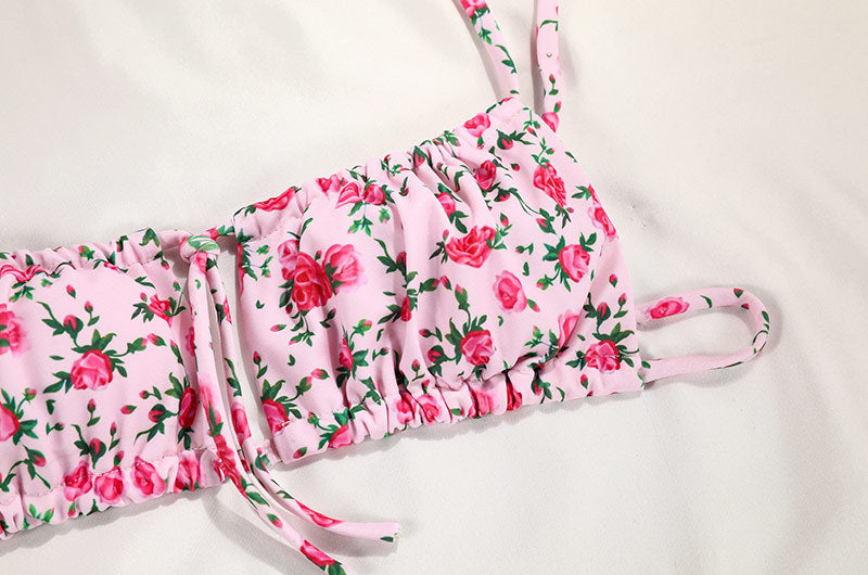 a pink garment top with pink flowers on it