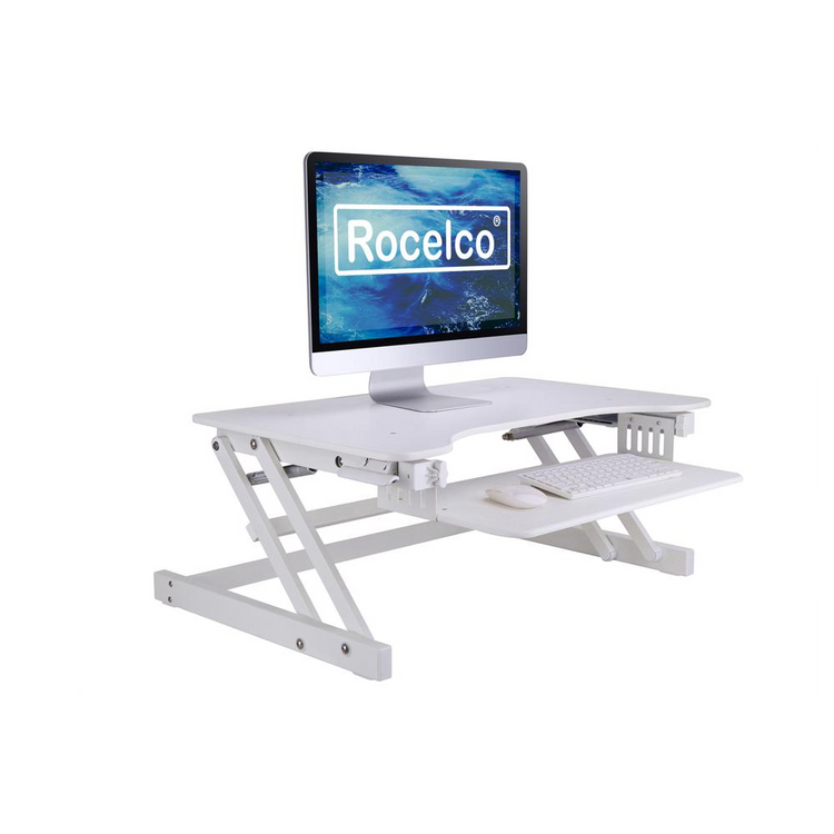 a white desk with a computer monitor and keyboard