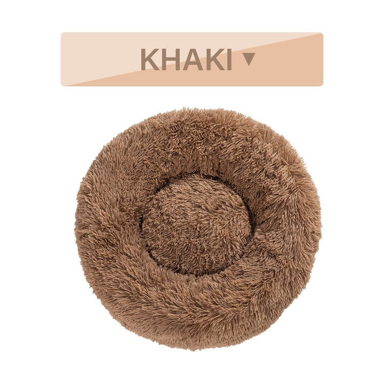 a brown furry pillow with a white background