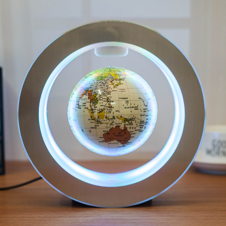 a globe in a circle with a light on it