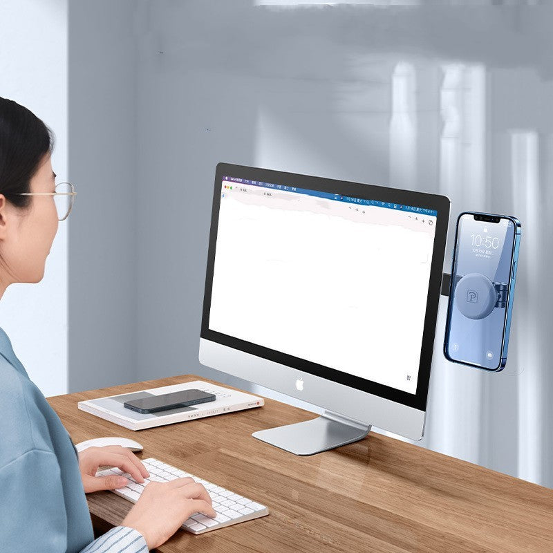 a woman sitting at a desk using a computer