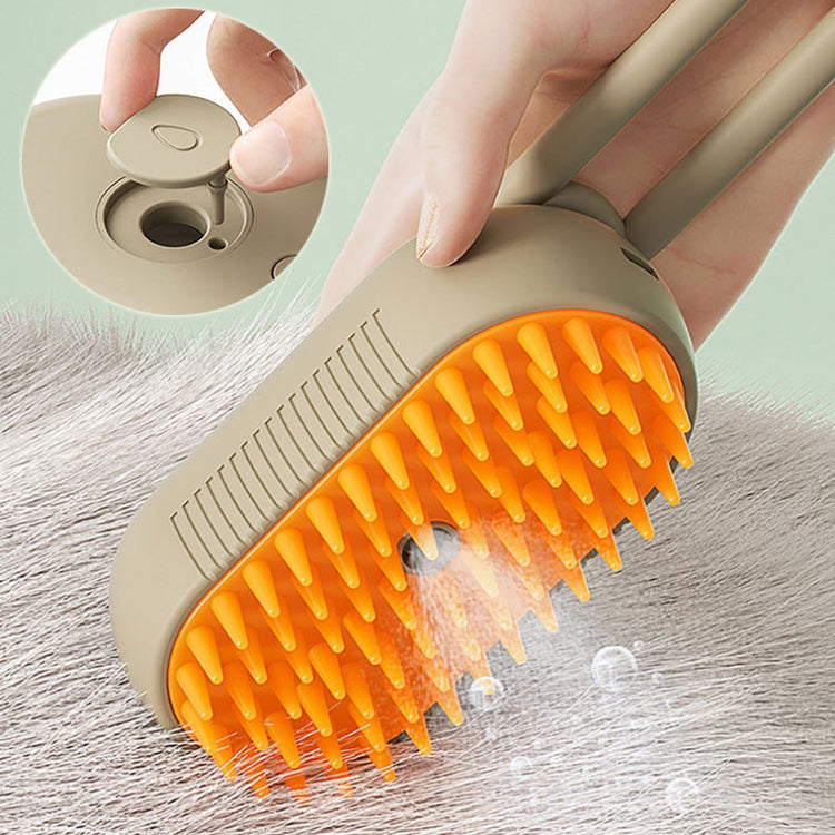 a hand holding a brush with orange bristles