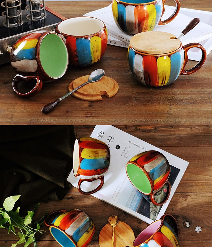 a group of colorful mugs on a table