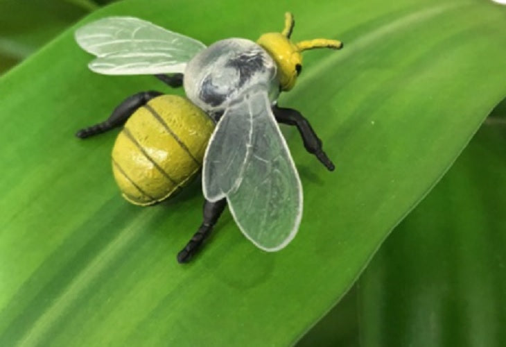 a toy bee on a leaf