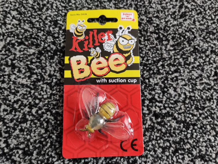 a plastic bee in a package