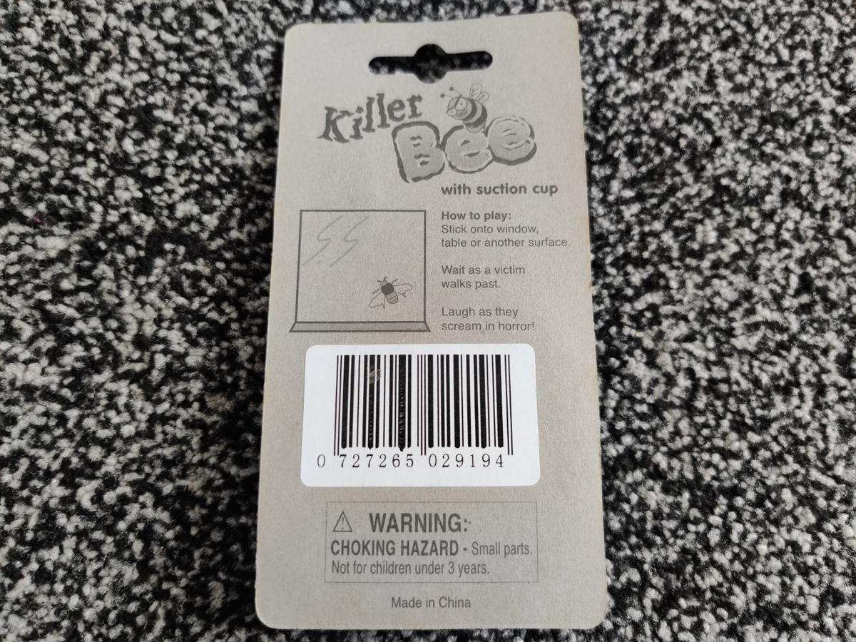 a grey and white package with a barcode on it