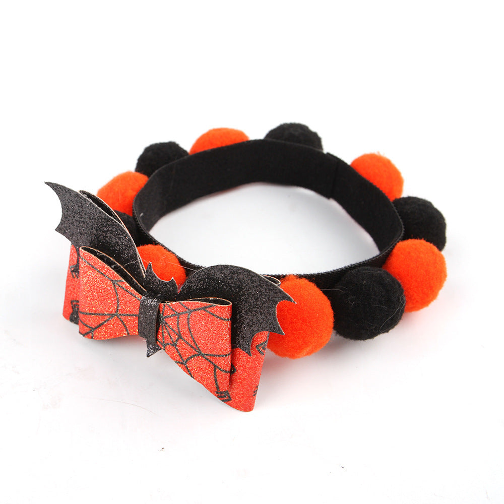 a headband with a bow and bat on it