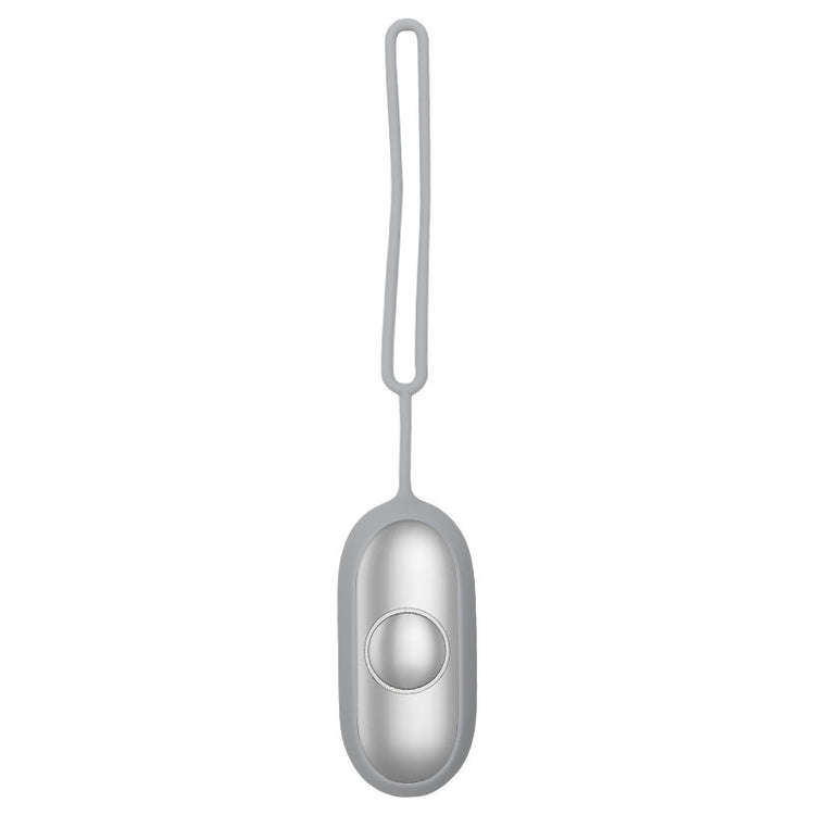a silver object with a round button