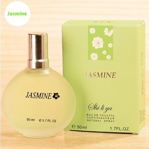 a bottle of perfume next to a box