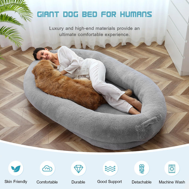 a woman lying on a dog bed