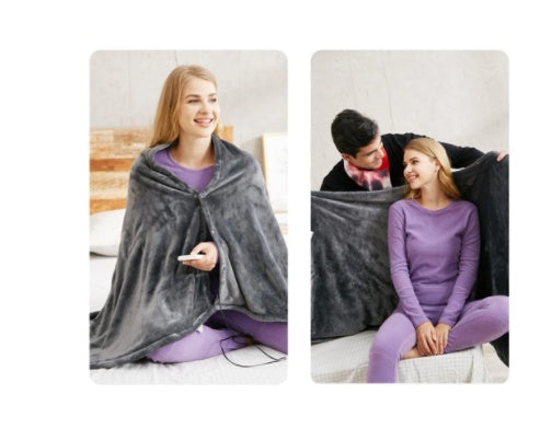 a woman sitting on a bed with a blanket