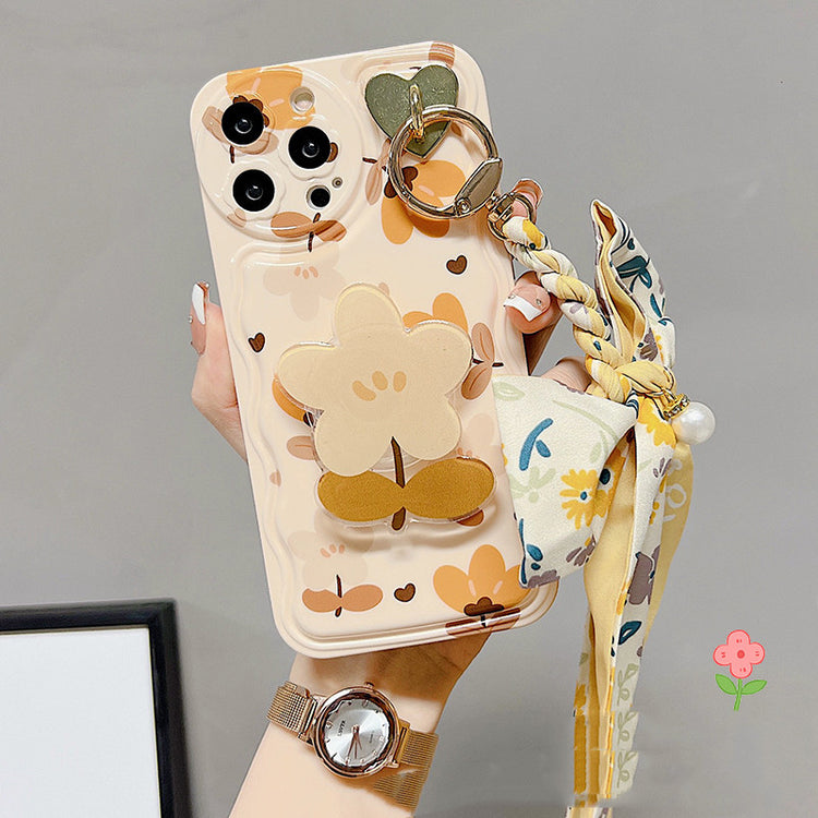 a hand holding a phone case
