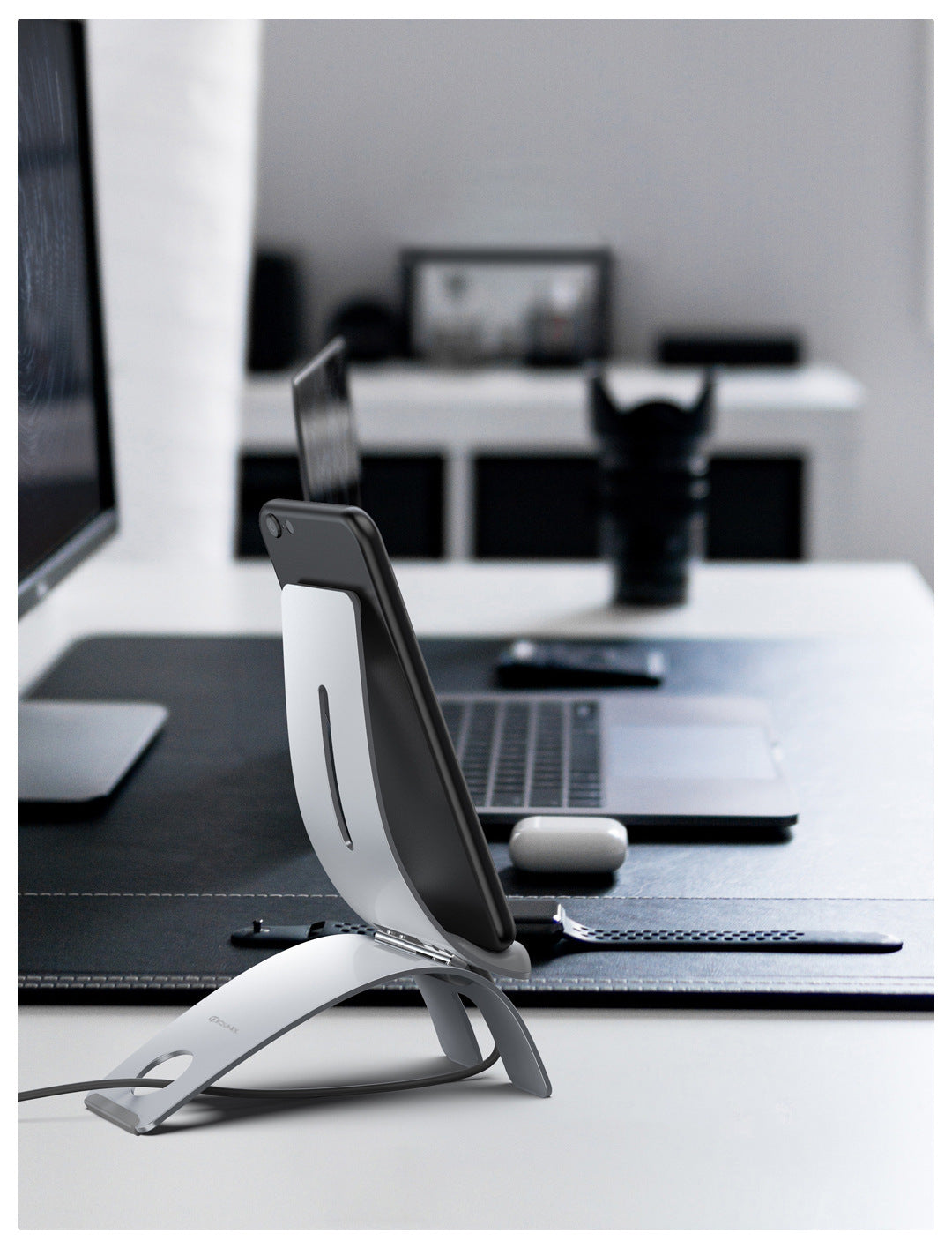 a laptop and a phone on a desk