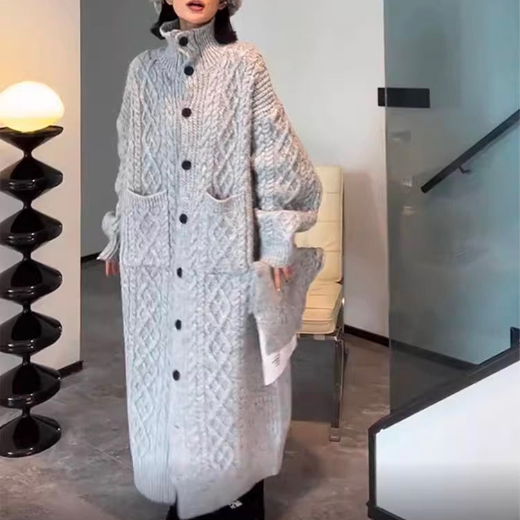 a woman in a long knitted coat