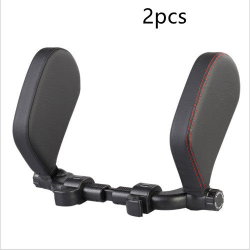 a black head rest with red stitching