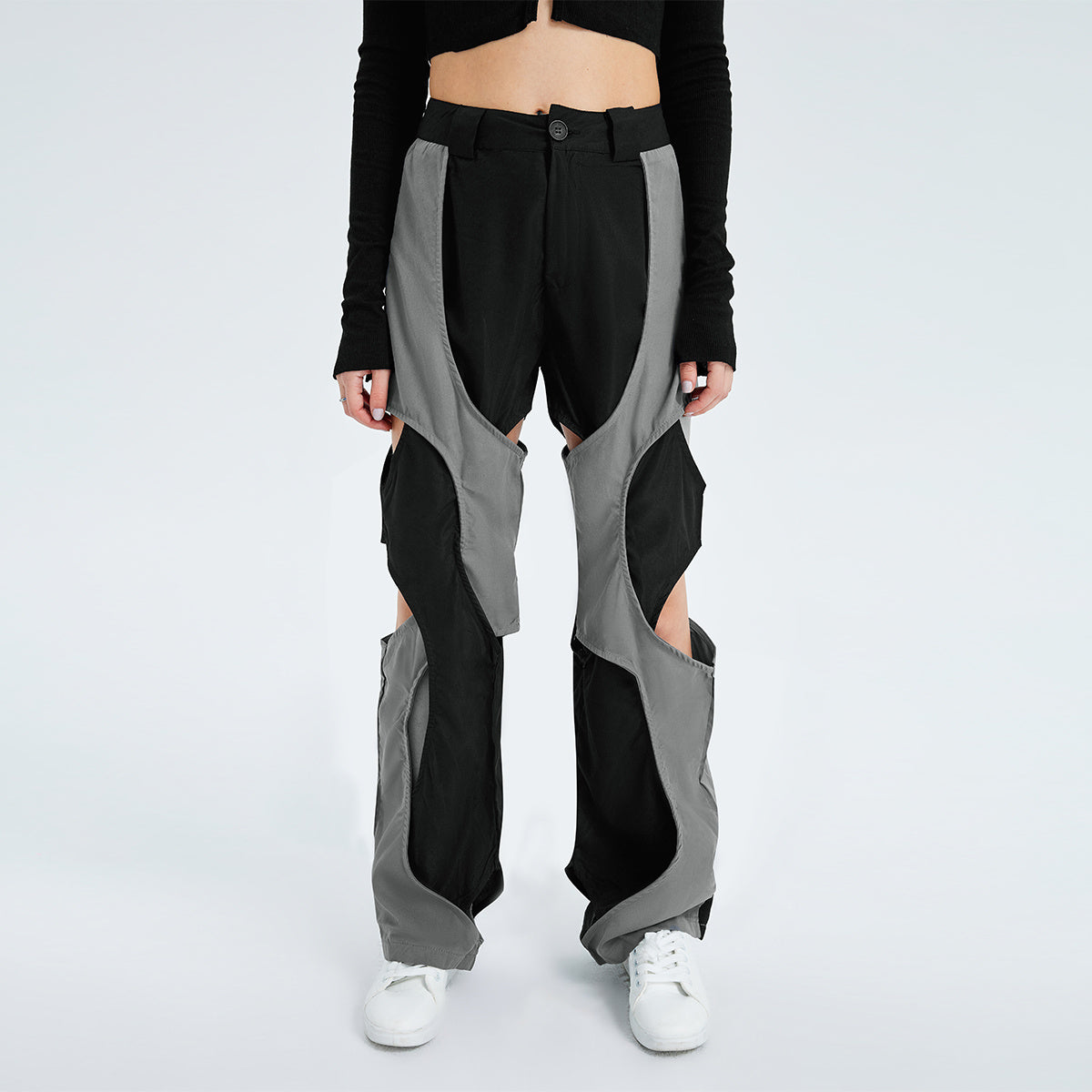 a person wearing black and grey pants
