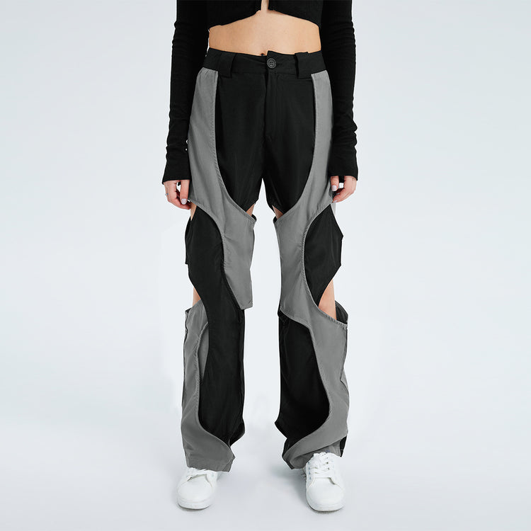 a person wearing black and grey pants