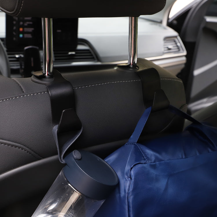 a bag and a bottle on the back of a car